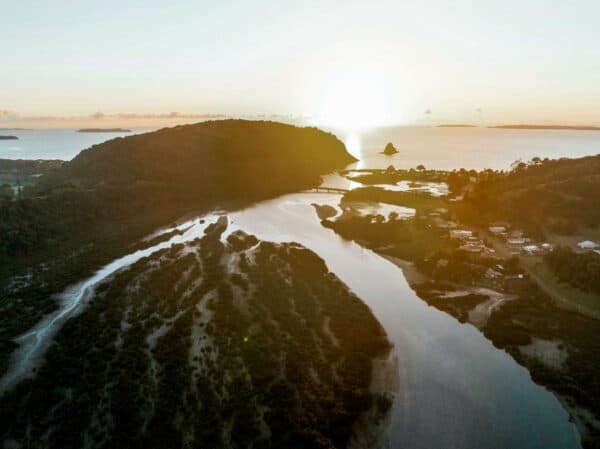 Scenic landscape of river and hills at sunset for Resilience Platform.